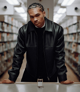 Person standing in library with Space fragrance